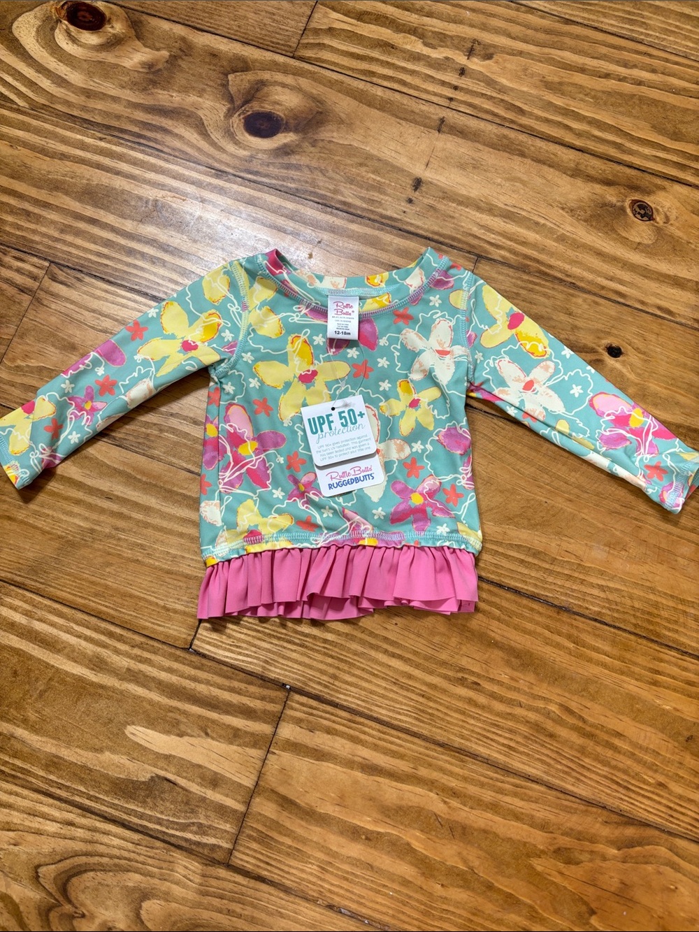 NWT Ruffle Butts Size 12-18 Months Waltzing on Water Long Sleeve Rash Guard Top